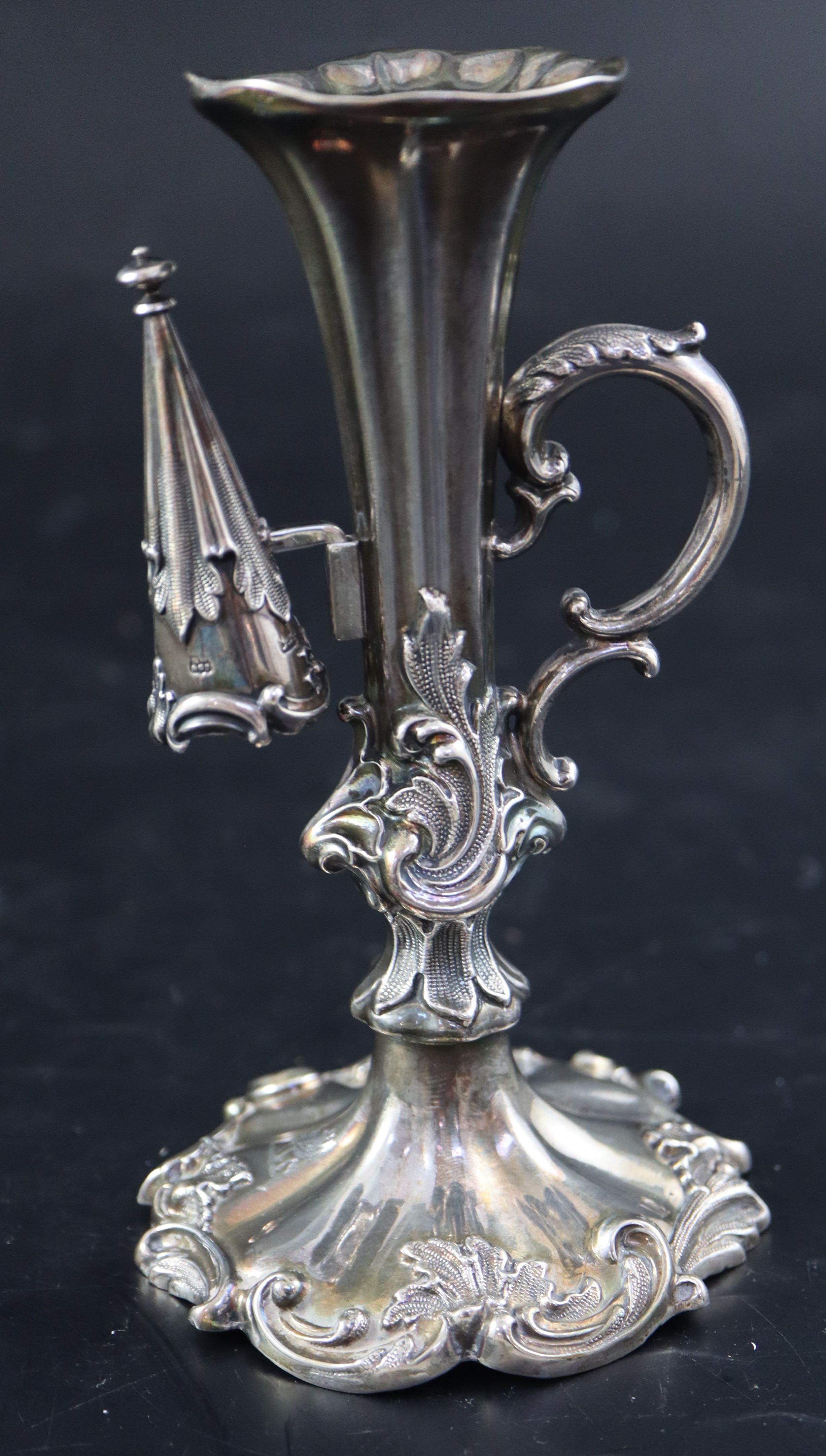 An ornate Victorian silver chamberstick, 14.3cm, gross 194 grams.